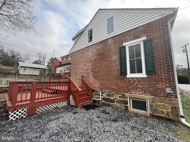 view of home's exterior featuring a deck