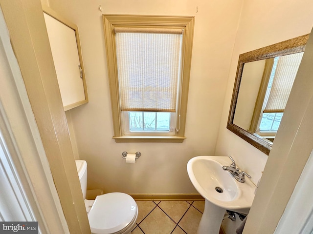 bathroom with sink, tile patterned floors, and toilet