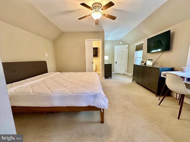 carpeted bedroom with lofted ceiling, ensuite bath, and ceiling fan