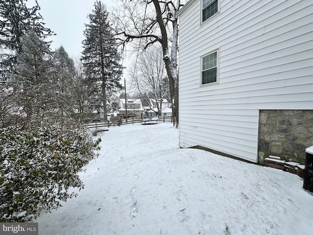 view of yard covered in snow