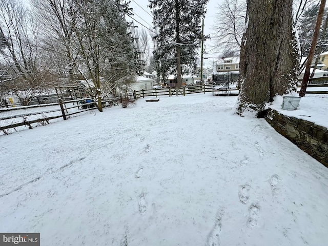 view of yard layered in snow