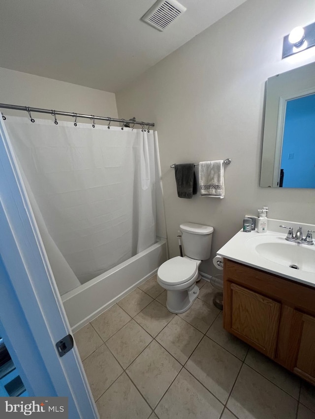 full bathroom with vanity, shower / tub combo, tile patterned floors, and toilet