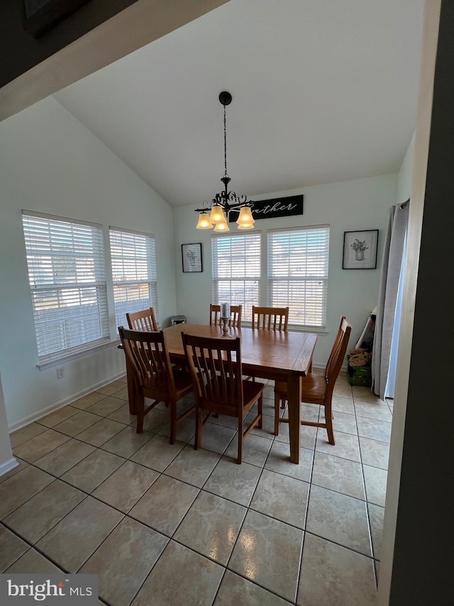 dining room with tile patterned flooring, lofted ceiling, and a notable chandelier