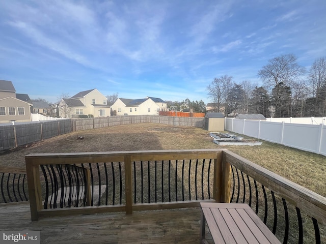 wooden deck with a storage shed