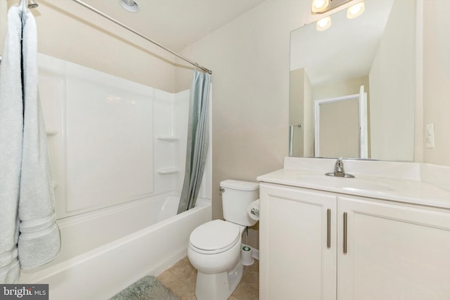 full bathroom with tile patterned floors, vanity, shower / tub combo, and toilet