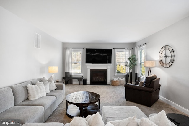 living room with a healthy amount of sunlight and carpet floors