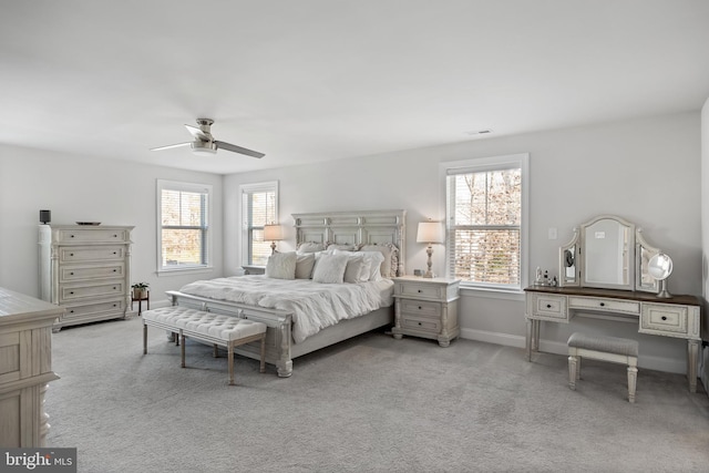 bedroom with light colored carpet and ceiling fan