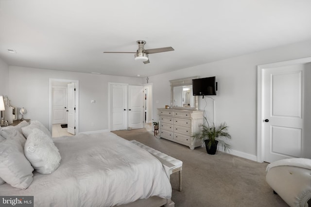 bedroom featuring ceiling fan and light carpet