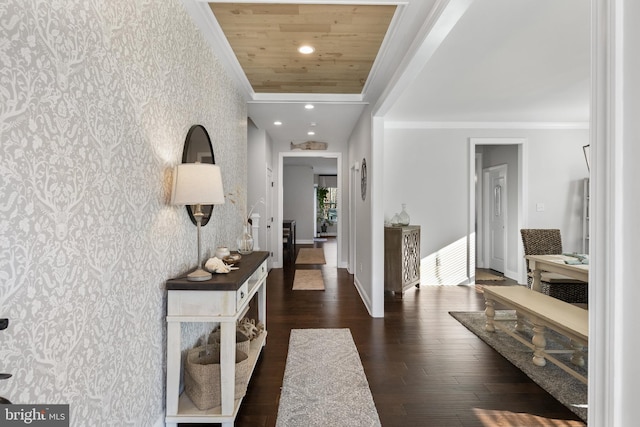 hallway featuring dark hardwood / wood-style flooring, wood ceiling, and ornamental molding