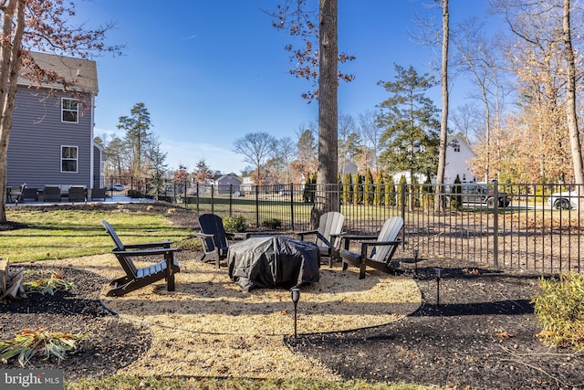 view of yard featuring an outdoor fire pit