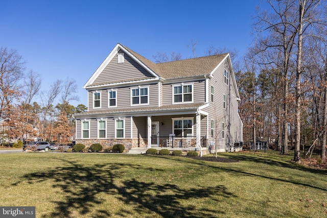 view of front of house featuring covered porch and a front lawn