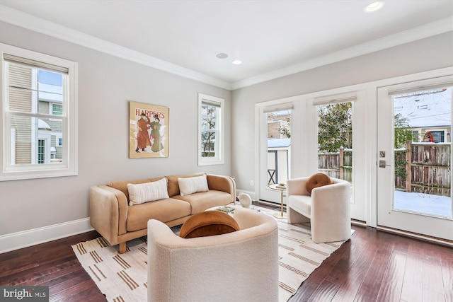 living room with hardwood / wood-style floors and ornamental molding