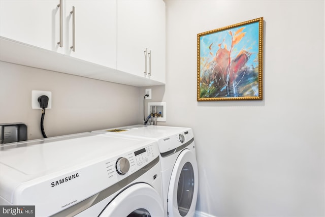 laundry area with cabinets and independent washer and dryer