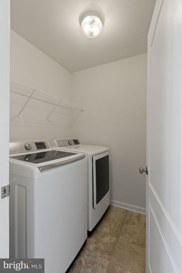 washroom featuring separate washer and dryer