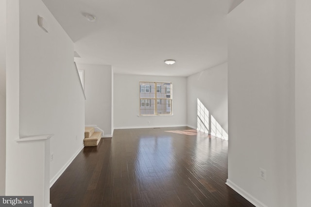 spare room with dark hardwood / wood-style flooring