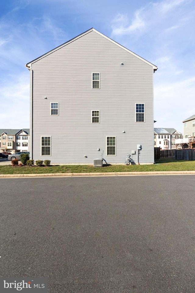 view of side of property with central AC unit