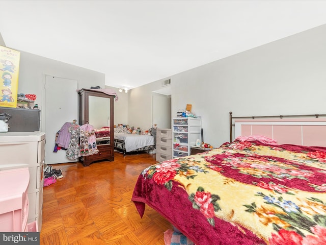 bedroom with parquet flooring