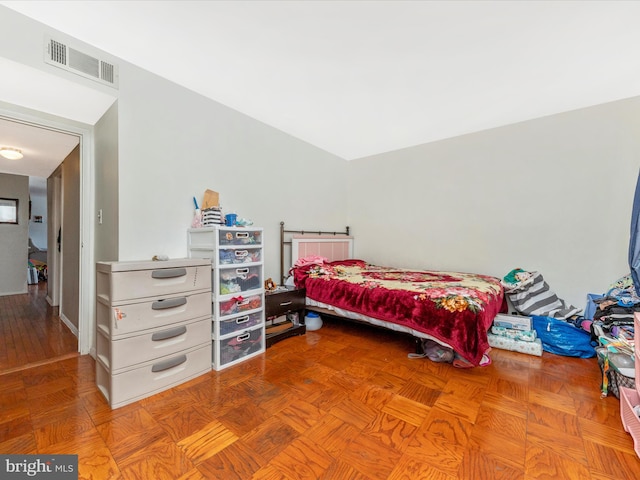 bedroom featuring parquet floors