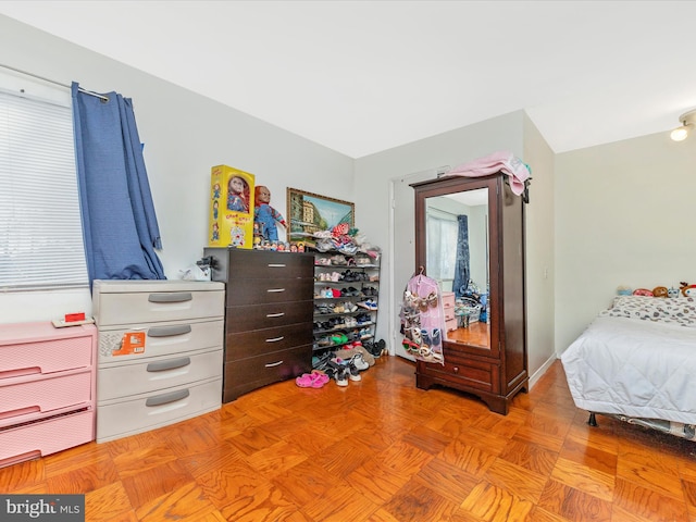 bedroom featuring light parquet floors