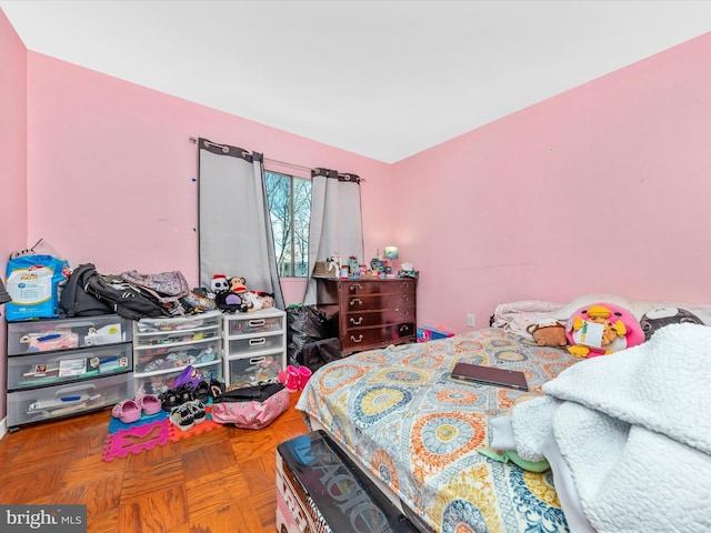 bedroom featuring parquet floors