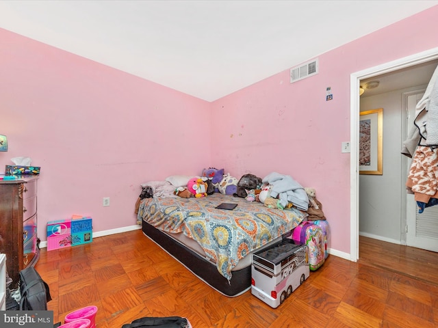 bedroom featuring parquet floors