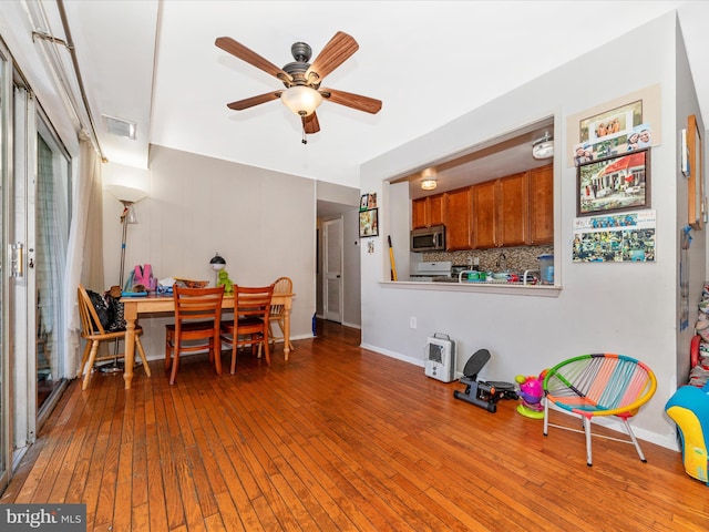 dining area featuring light hardwood / wood-style floors and ceiling fan