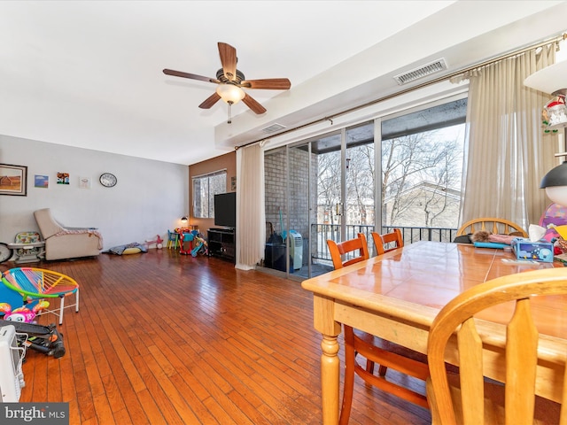 dining space featuring ceiling fan and wood-type flooring