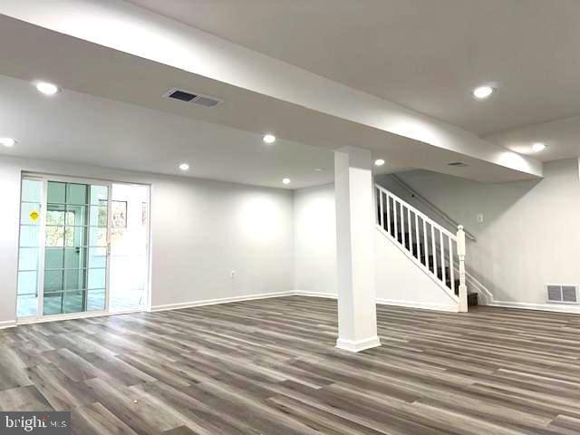 basement featuring dark hardwood / wood-style floors