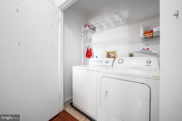 washroom featuring laundry area and washer and clothes dryer