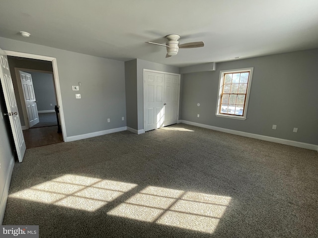 unfurnished bedroom featuring carpet, a closet, and ceiling fan