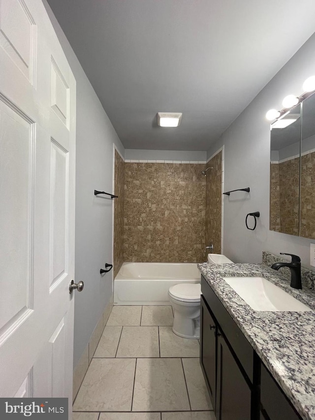 full bathroom with tile patterned flooring, vanity, toilet, and tiled shower / bath