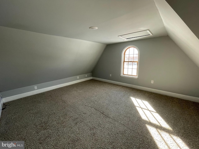 bonus room featuring carpet flooring and vaulted ceiling