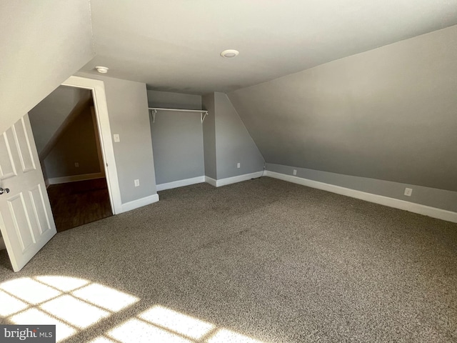 bonus room featuring carpet floors and lofted ceiling