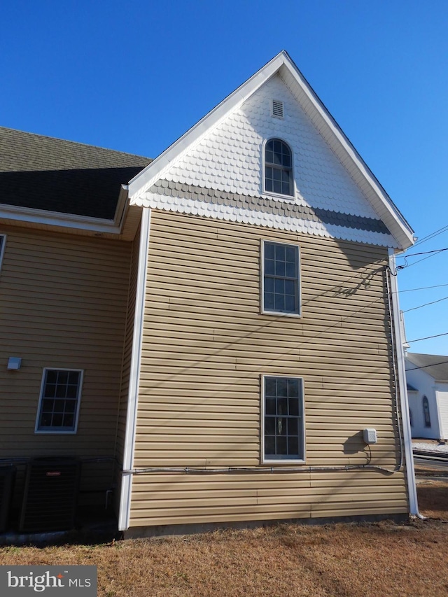 view of home's exterior with central AC