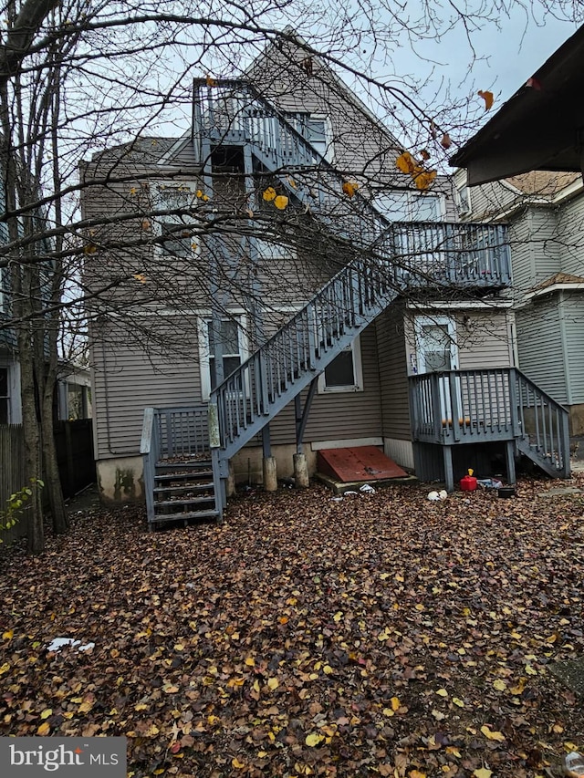 view of property exterior with a wooden deck