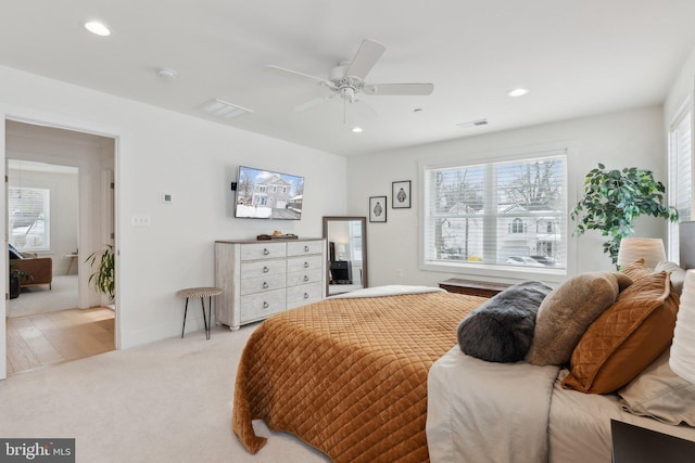 carpeted bedroom featuring ceiling fan