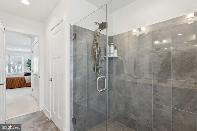 bathroom featuring a shower with shower door