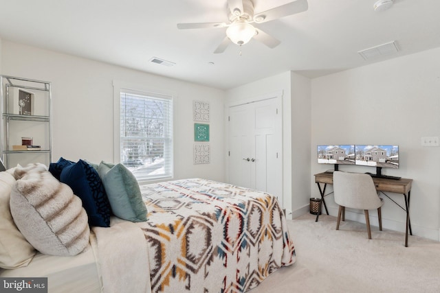 bedroom with ceiling fan and light carpet