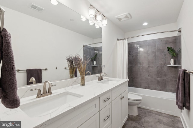 full bathroom featuring toilet, vanity, and shower / bath combination with curtain