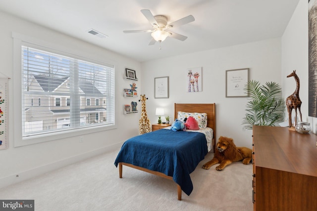 carpeted bedroom with ceiling fan