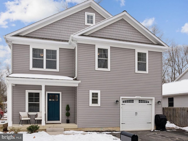 view of front of home featuring a garage and covered porch