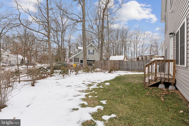 view of yard layered in snow