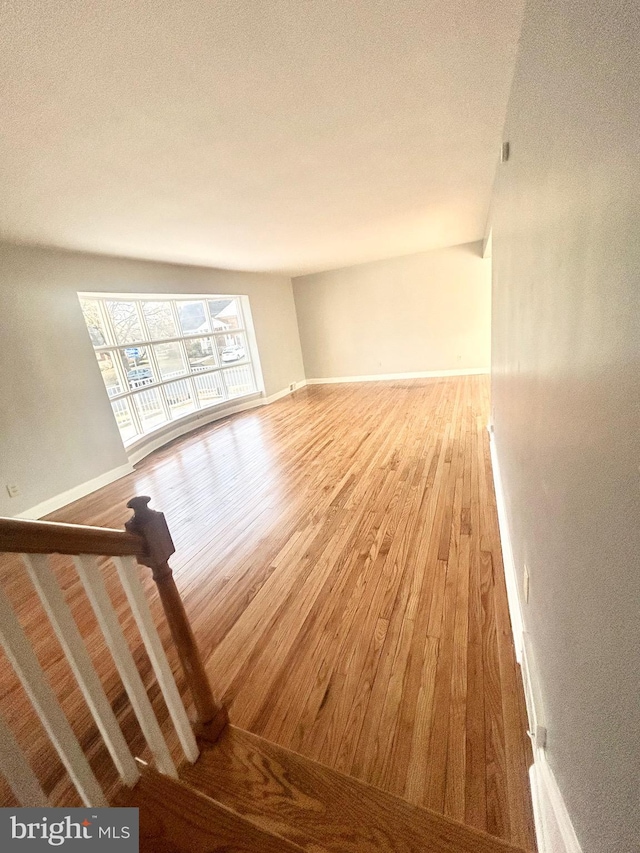 unfurnished living room featuring hardwood / wood-style floors