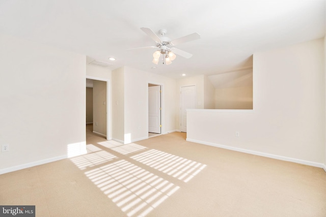 carpeted empty room featuring ceiling fan