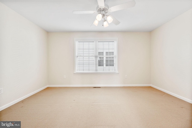 unfurnished room with light carpet and ceiling fan