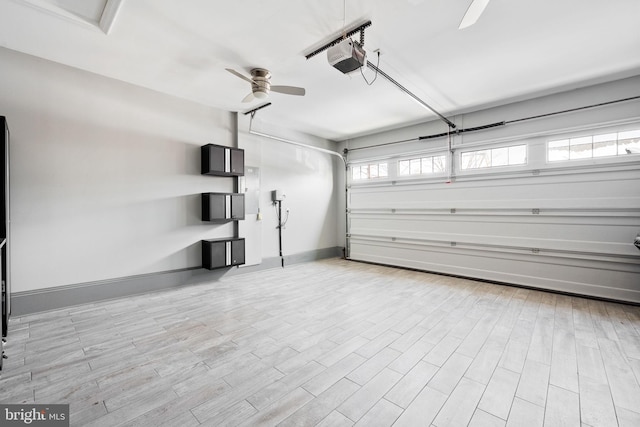 garage with a garage door opener and ceiling fan