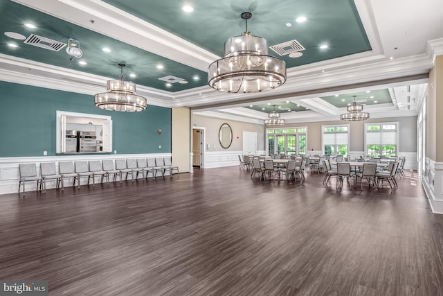 dining room featuring a raised ceiling, crown molding, and dark hardwood / wood-style floors