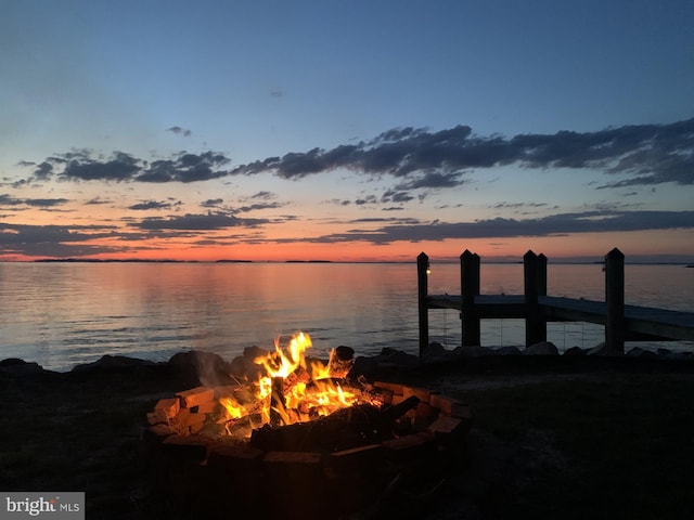 dock area featuring a water view and a fire pit