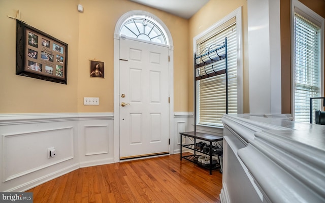 entryway with light hardwood / wood-style flooring