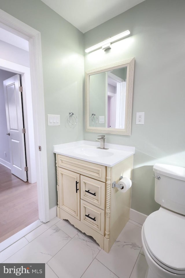 bathroom with vanity and toilet